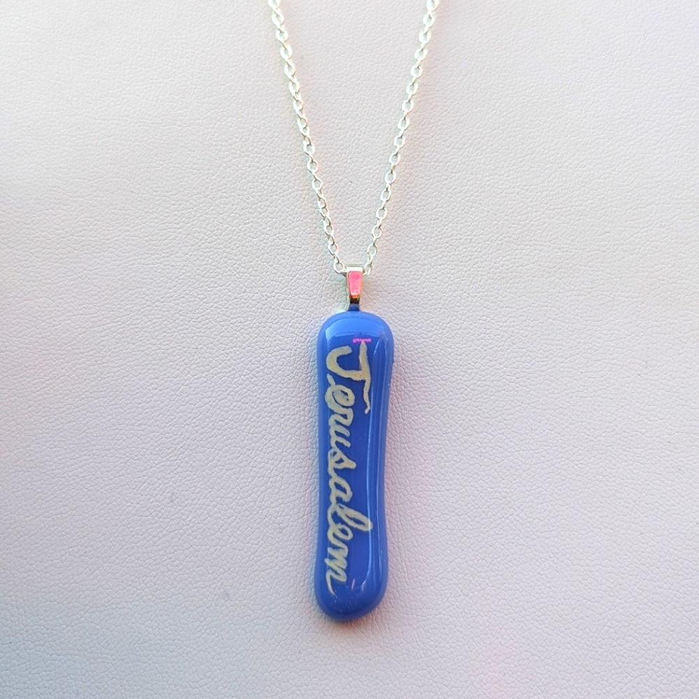 Hand crafted artisan made blue glass Jerusalem handwritten necklace.